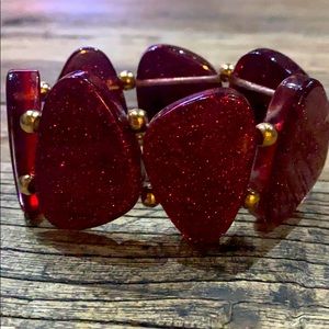 Red glittery bracelet.